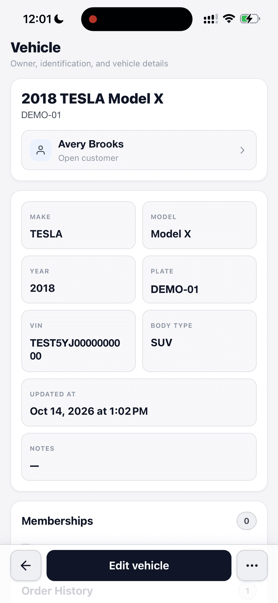 Fictional vehicle record with a sample owner, demonstration plate, test VIN, make, model, year, and body type