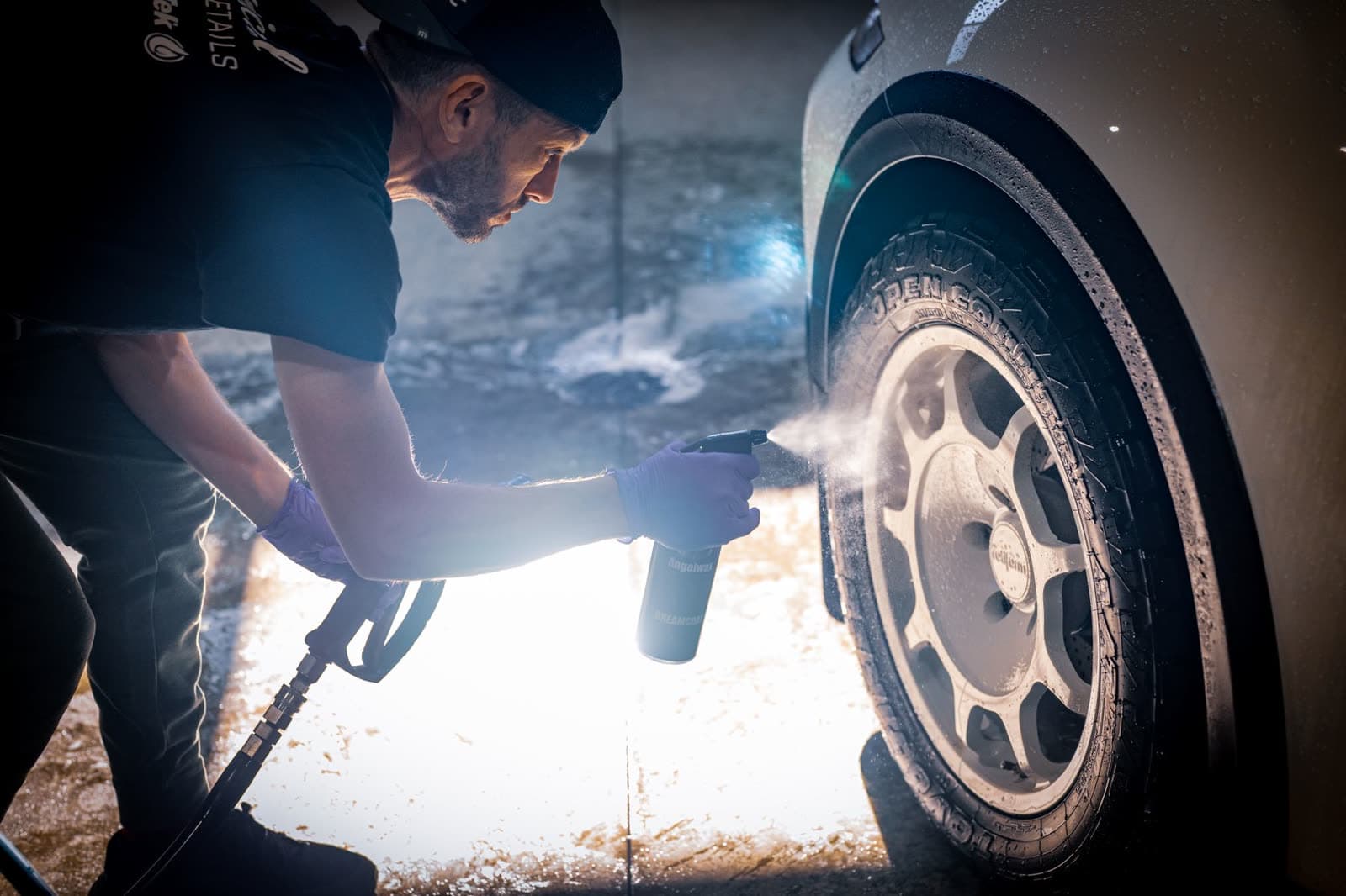Mobile detailer cleaning a wheel